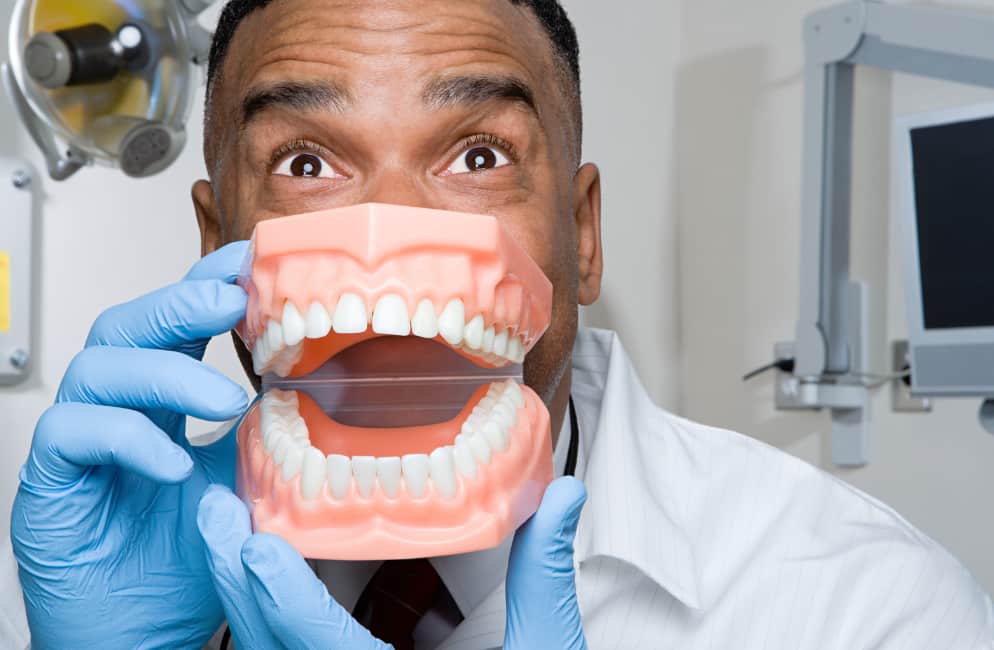 dentist with fake teeth